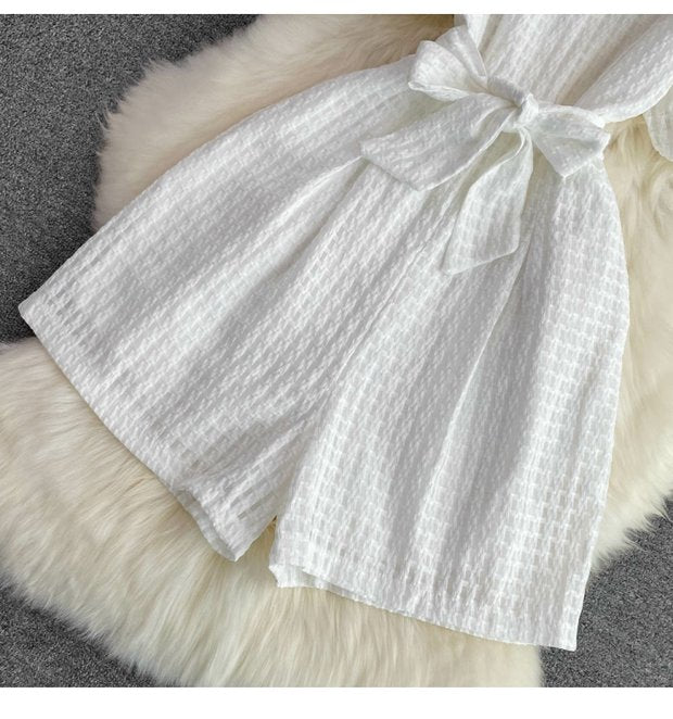 "Luxury White Textured Puff Sleeve Romper – Premium Tailored Fit with Chic Waist Tie & Elegant Silhouette"