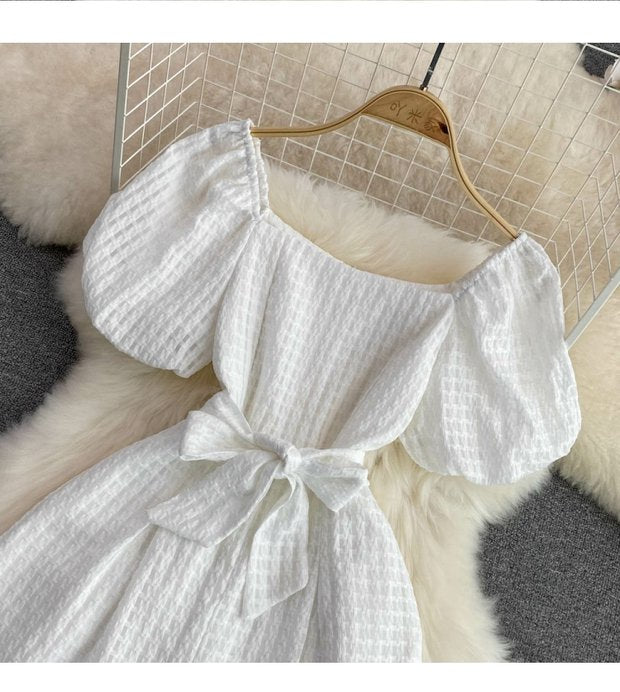 "Luxury White Textured Puff Sleeve Romper – Premium Tailored Fit with Chic Waist Tie & Elegant Silhouette"