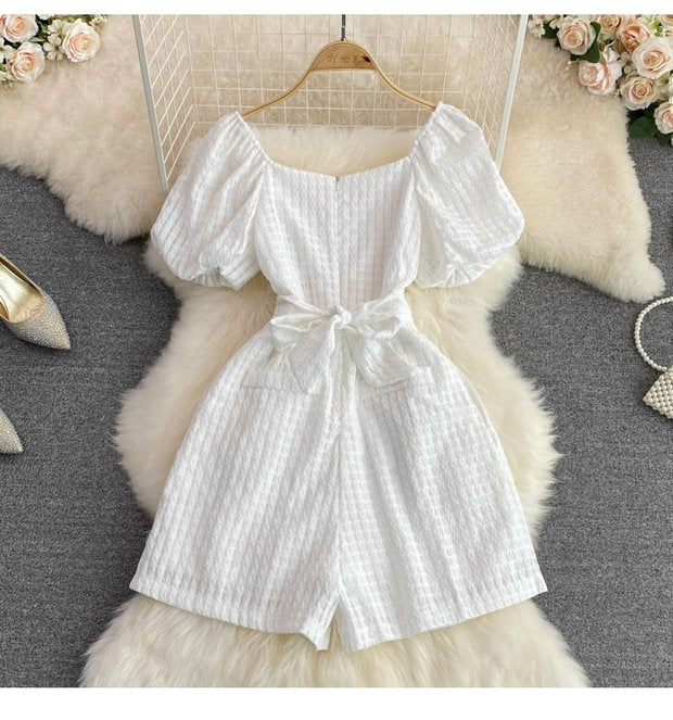 "Luxury White Textured Puff Sleeve Romper – Premium Tailored Fit with Chic Waist Tie & Elegant Silhouette"