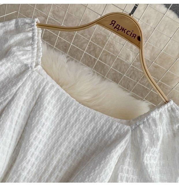 "Luxury White Textured Puff Sleeve Romper – Premium Tailored Fit with Chic Waist Tie & Elegant Silhouette"