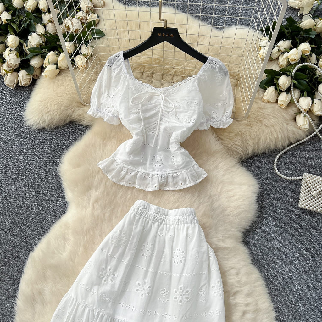 "Elegant White Two-Piece Eyelet Cotton Set – Puff Sleeve Peplum Top & Tiered Maxi Skirt"